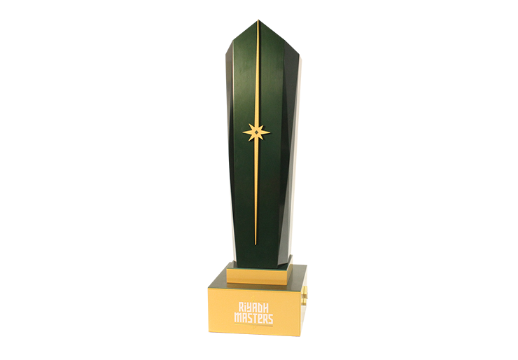 Custom green tower award that comes to a point, possessing a beautiful gold star in the middle